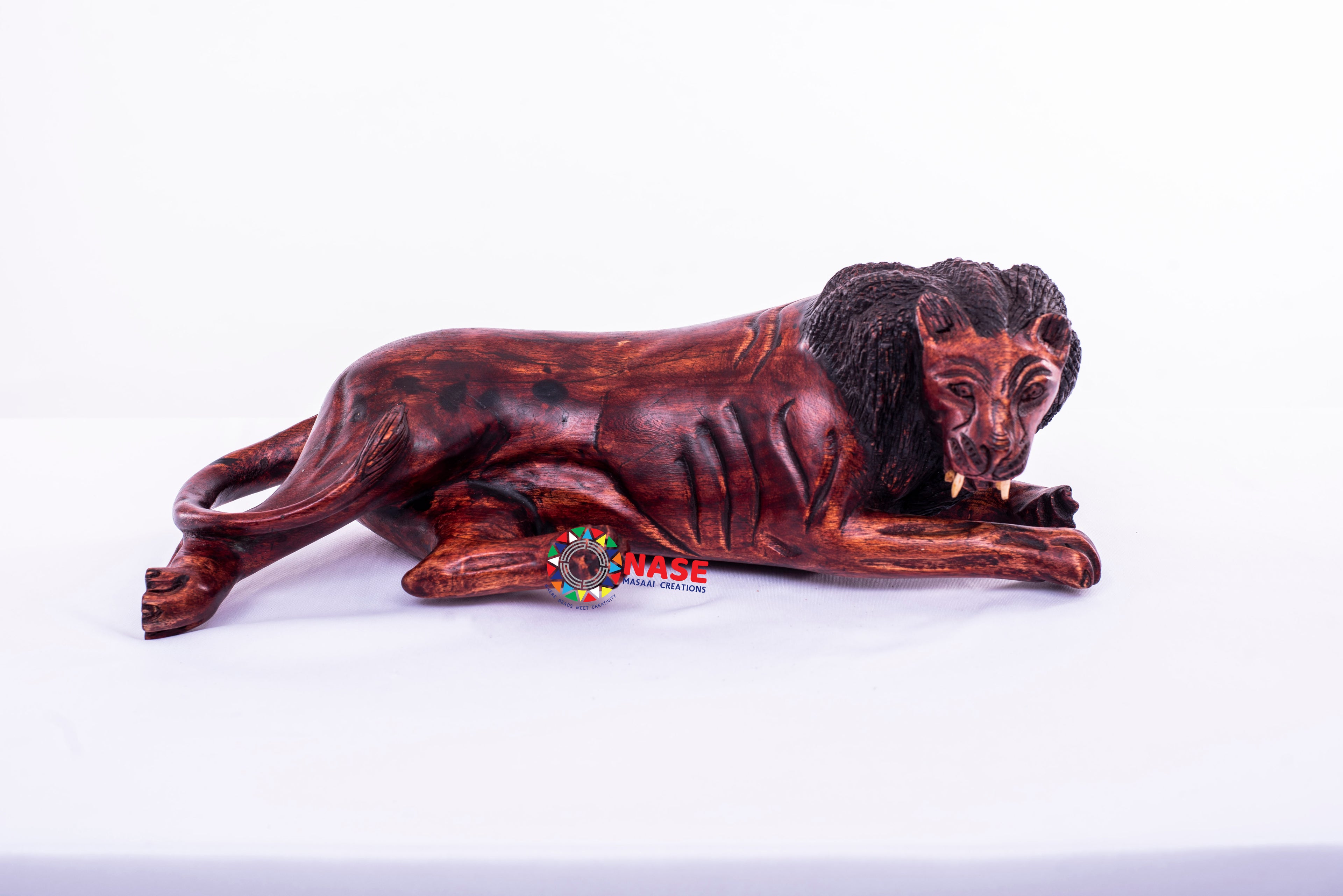RELAXING LION WOODEN CARVINGS