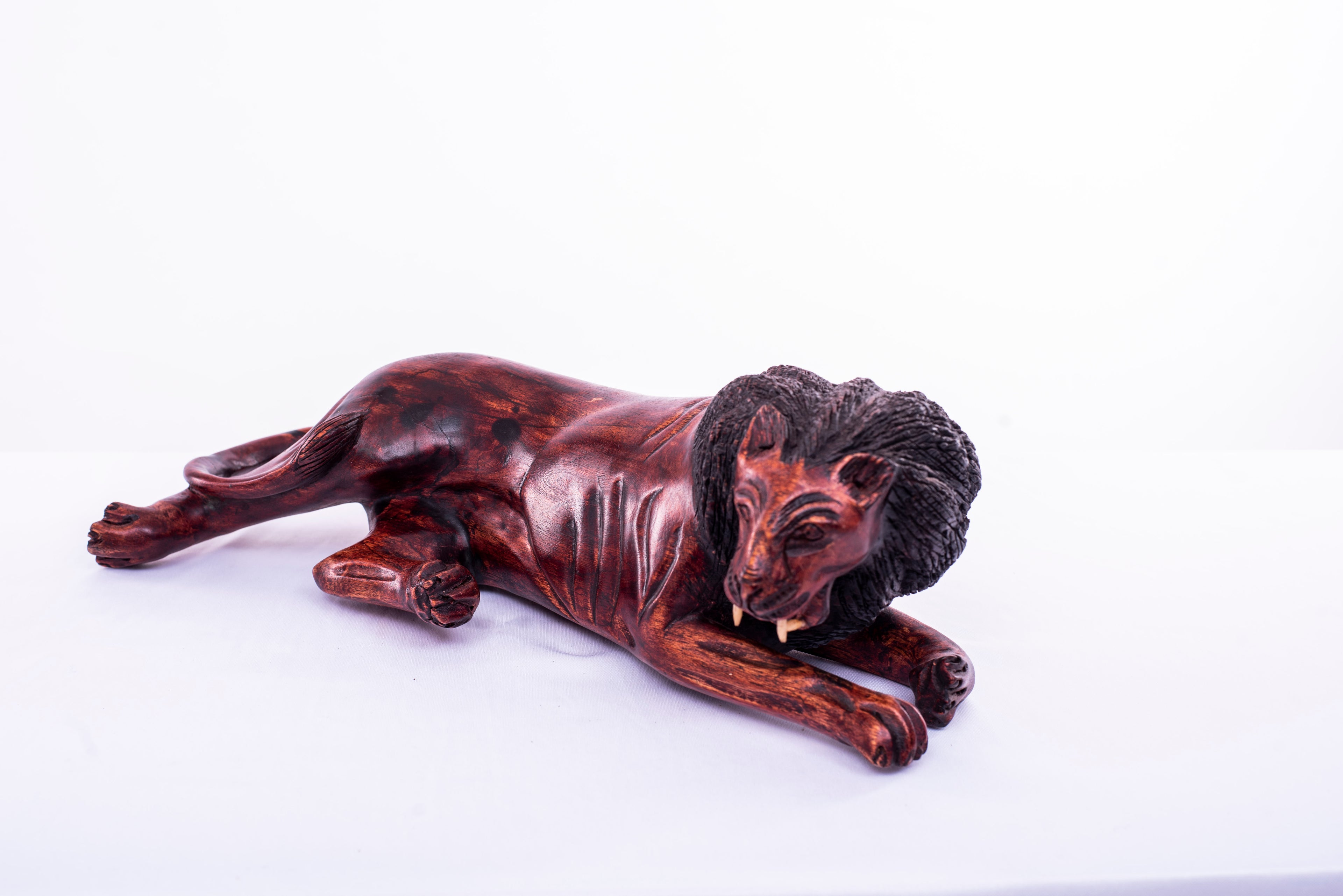 RELAXING LION WOODEN CARVINGS