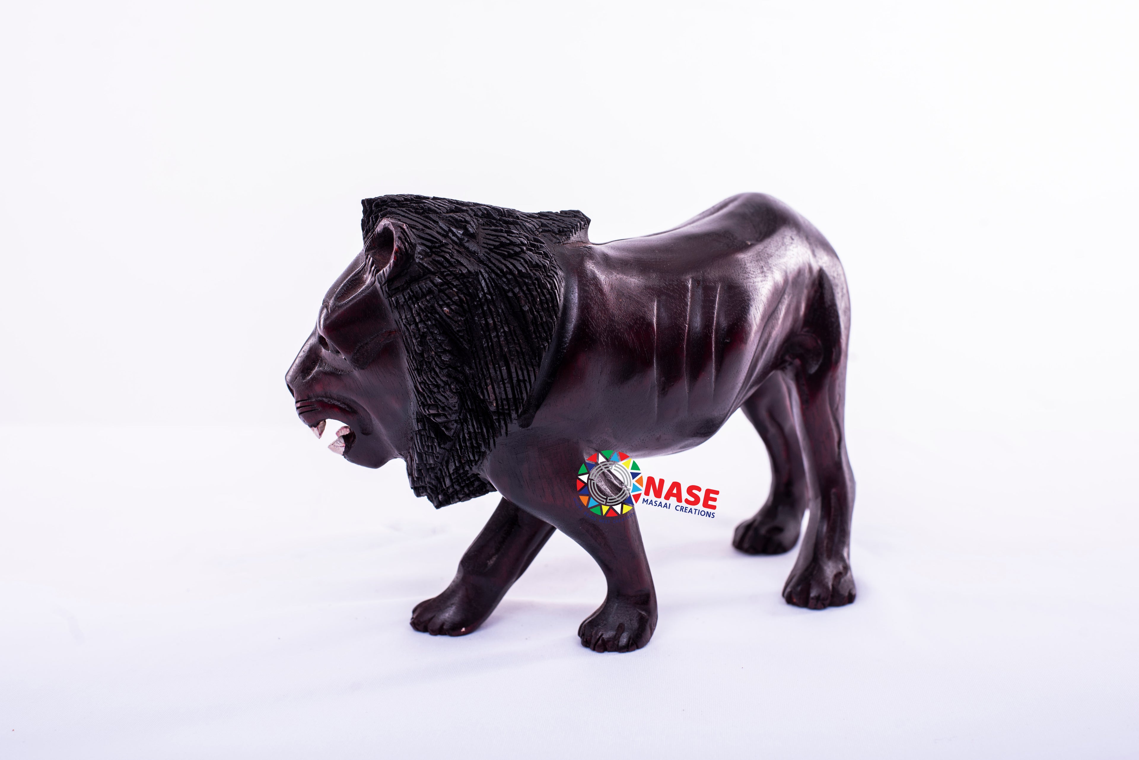 WOODEN CARVINGS OF KING LION WALKING