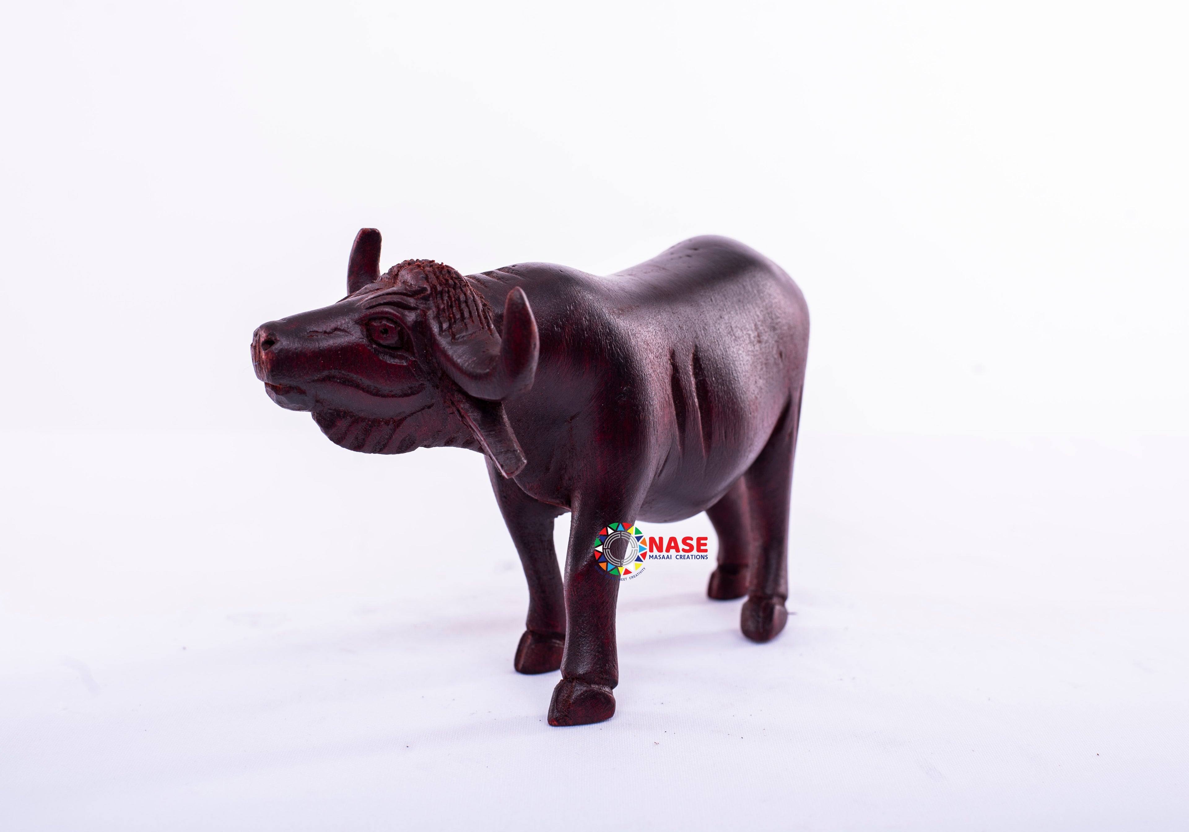 WOODEN HAND MADE CARVINGS OF A BUFFALO