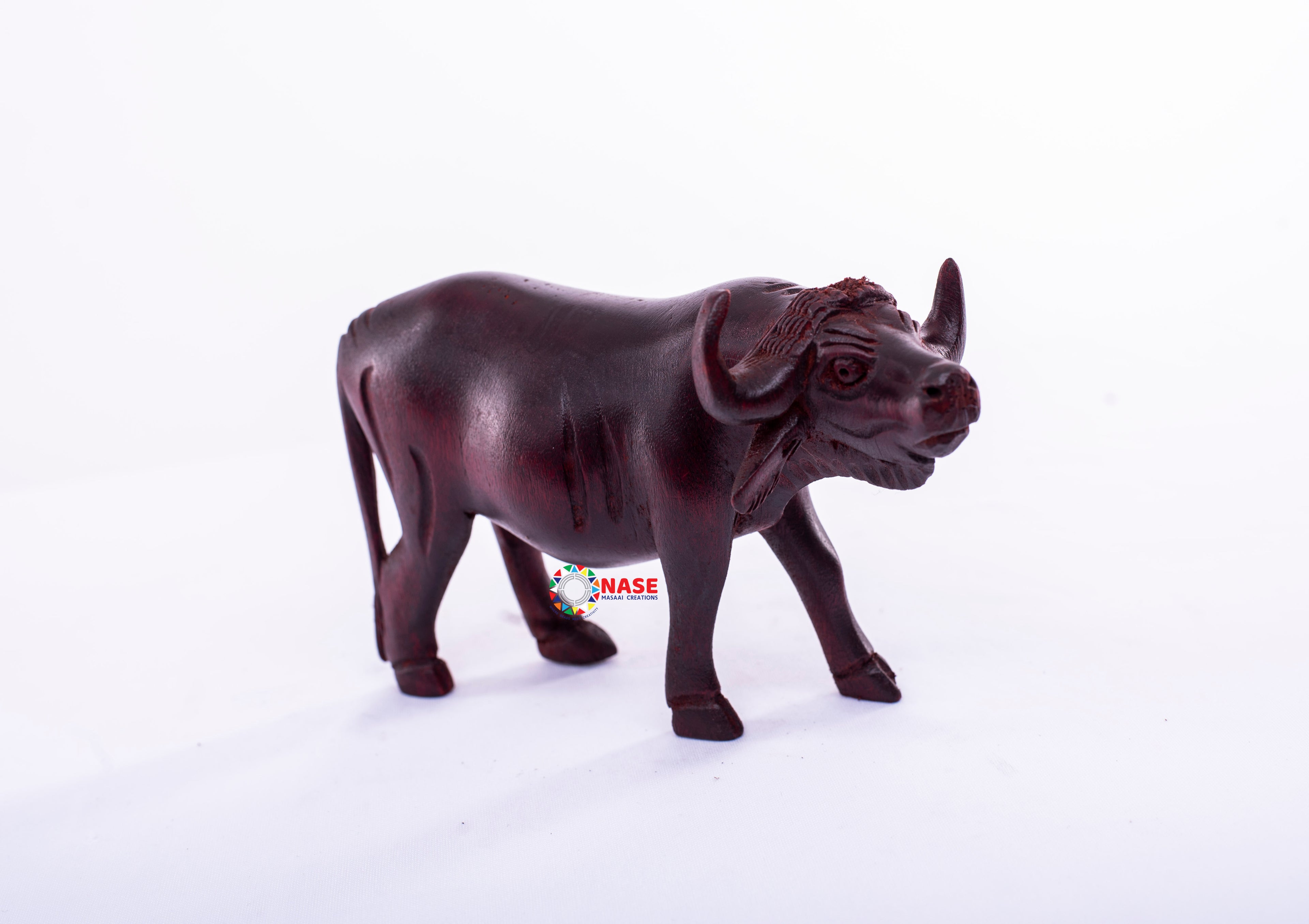 WOODEN HAND MADE CARVINGS OF A BUFFALO